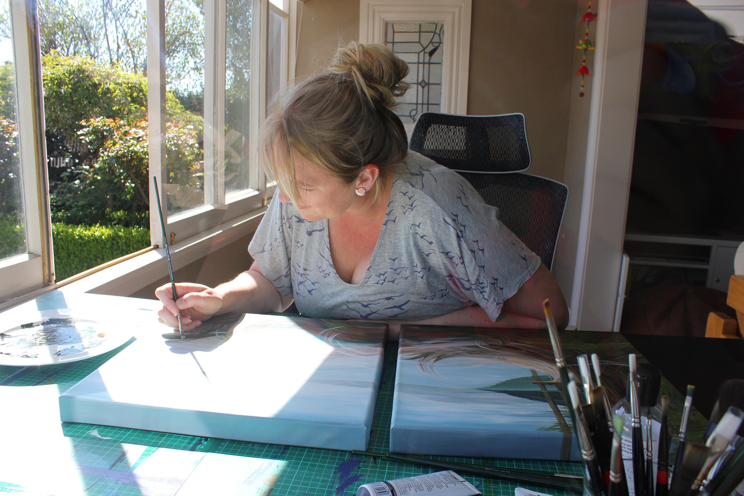 Roselyn Fauth nee Cloake painting in her Jackson St home studio