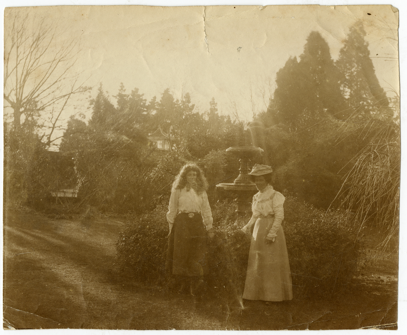 Two women in the garden of The Pines Bowkers 14757 Canterbury Stories